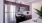 a kitchen with a refrigerator and stove
