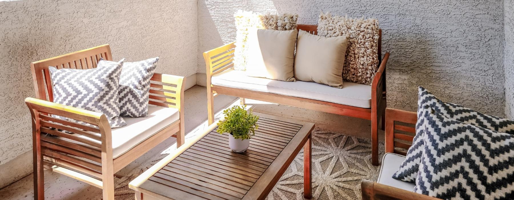 a group of chairs and a table outside