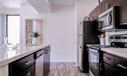 a kitchen with black appliances